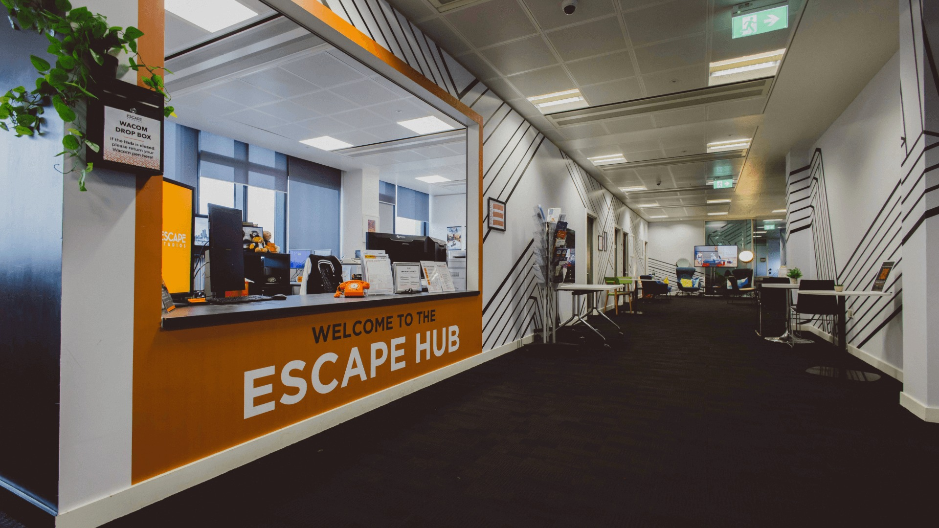 The reception desk with the words "Welcome to the Escape Hub" written on the front